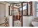 Modern shower with a glass door, stone floors, and rain shower head at 2131 Timmerman Rd., Myrtle Beach, SC 29588