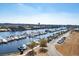 Stunning aerial view of a marina with boats docked, coastal waterway, and nearby landscaping at 2151 Bridge View Ct. # 2705, North Myrtle Beach, SC 29582