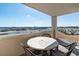 Enjoy gorgeous views of the waterway from this condo balcony with seating and tables at 2151 Bridge View Ct. # 2705, North Myrtle Beach, SC 29582