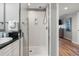 Bathroom features a glass enclosed shower and sink with black countertop and white cabinets at 2151 Bridge View Ct. # 2705, North Myrtle Beach, SC 29582