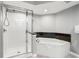 The primary bath features a soaking tub and a glass enclosed shower with sleek fixtures at 2151 Bridge View Ct. # 2705, North Myrtle Beach, SC 29582