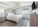 Bright bedroom featuring a bed with light wood frame, ceiling fan and view from window at 2151 Bridge View Ct. # 2705, North Myrtle Beach, SC 29582