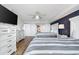 Bedroom with 2 beds featuring striped comforters, a ceiling fan and an ensuite bathroom at 2151 Bridge View Ct. # 2705, North Myrtle Beach, SC 29582