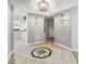 Foyer with tiled floor, chandelier, and views into the kitchen, and hall area at 2151 Bridge View Ct. # 2705, North Myrtle Beach, SC 29582