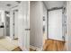 Hallway with multiple doors leading to the bathroom and bedrooms areas of the property at 2151 Bridge View Ct. # 2705, North Myrtle Beach, SC 29582