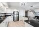 Kitchen featuring white cabinets, stainless steel refrigerator and tile floors at 2151 Bridge View Ct. # 2705, North Myrtle Beach, SC 29582