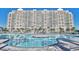 Large community pool with ample lounge space, in front of a condo building at 2151 Bridge View Ct. # 2705, North Myrtle Beach, SC 29582