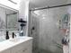 Modern bathroom with a glass-enclosed shower and bright white vanity at 220 Starcrest Circle, North Myrtle Beach, SC 29582