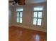 Bedroom with hardwood floors and large shuttered windows at 220 Starcrest Circle, North Myrtle Beach, SC 29582