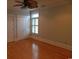 Bedroom with neutral walls, hardwood floors and large windows at 220 Starcrest Circle, North Myrtle Beach, SC 29582