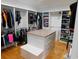 Custom walk-in closet boasts ample storage, center island and custom shelving at 220 Starcrest Circle, North Myrtle Beach, SC 29582
