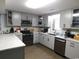 Updated kitchen with gray cabinets, granite countertops, and stainless steel appliances at 220 Starcrest Circle, North Myrtle Beach, SC 29582
