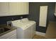 Convenient laundry room with washer, dryer, and ample storage at 220 Starcrest Circle, North Myrtle Beach, SC 29582