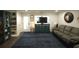Spacious living room features a comfortable sofa, large windows, and a TV at 220 Starcrest Circle, North Myrtle Beach, SC 29582