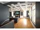 Spacious living room with hardwood floors, a fireplace, built-in shelving, and coffered ceilings at 220 Starcrest Circle, North Myrtle Beach, SC 29582