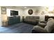 Comfortable living room with a plush sofa, blue rug and coastal decor accents at 220 Starcrest Circle, North Myrtle Beach, SC 29582