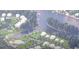 Aerial view of the community featuring waterfront homes, a pool, tennis courts, and a scenic waterway at 232 River Edge Dr., Myrtle Beach, SC 29588