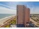 Panoramic aerial view of a beachfront condo building, with ocean views, beach access, and nearby attractions at 2504 Ocean Blvd. # 1134, Myrtle Beach, SC 29577