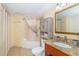 Bright bathroom featuring a tub with shower, granite countertop vanity, and storage cabinet for optimal organization at 2504 Ocean Blvd. # 1134, Myrtle Beach, SC 29577