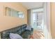 Bedroom area features a couch with a view of the private balcony and ocean at 2504 Ocean Blvd. # 1134, Myrtle Beach, SC 29577