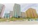 Exterior shot of condos with balconies, showcasing beachfront living and nearby beach access at 2504 Ocean Blvd. # 1134, Myrtle Beach, SC 29577