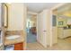 Comfortable interior showcasing the home's layout, with a sink/vanity, living room, and kitchen visible from the hallway at 2504 Ocean Blvd. # 1134, Myrtle Beach, SC 29577