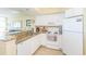 Well-equipped kitchen featuring white appliances, granite countertops, and ample cabinet space for convenient cooking at 2504 Ocean Blvd. # 1134, Myrtle Beach, SC 29577