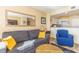 Comfortable living room with a gray sofa, yellow throw pillows and a view of the well-equipped kitchen at 2504 Ocean Blvd. # 1134, Myrtle Beach, SC 29577