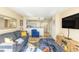 The condo's living space features a modern couch, kitchen, and ocean views that create a bright atmosphere at 2504 Ocean Blvd. # 1134, Myrtle Beach, SC 29577