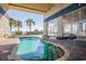 Indoor/outdoor pool and hot tub area with a view of palm trees and the ocean on a sunny day at 2504 Ocean Blvd. # 1134, Myrtle Beach, SC 29577