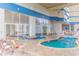 Indoor pool area with clear blue water, seating for relaxation, and glass windows for natural light at 2504 Ocean Blvd. # 1134, Myrtle Beach, SC 29577