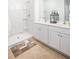 Bright bathroom with double sink vanity, granite countertop, and a tiled walk-in shower at 256 Warner Crossing Way, Loris, SC 29569