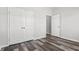 Bright bedroom features double doors for closet and luxury vinyl plank flooring at 272 Stillbrook Dr., Longs, SC 29568