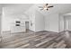 Open-concept space showcases wood-look flooring, recessed lighting, and a vaulted ceiling with a ceiling fan at 272 Stillbrook Dr., Longs, SC 29568