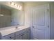 Clean bathroom with a single vanity, large mirror, and a shower-tub combination at 275 Stillbrook Dr., Longs, SC 29568