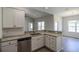 Stylish kitchen showcasing granite counters, stainless appliances, white cabinets, and a breakfast bar at 275 Stillbrook Dr., Longs, SC 29568