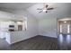 Bright and open living space with wood floors flowing to the kitchen area and front entrance at 275 Stillbrook Dr., Longs, SC 29568