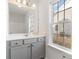 Bathroom featuring a gray vanity with ample counter space, a view from the window, and great lighting at 276 Stillbrook Dr., Longs, SC 29568