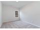 A cozy, carpeted bedroom with a large window that allows natural light in, perfect for relaxation at 276 Stillbrook Dr., Longs, SC 29568