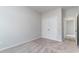 A bright bedroom offers a spacious double-door closet with adjacent doorways leading to other rooms at 276 Stillbrook Dr., Longs, SC 29568