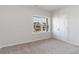 Cozy bedroom features a window with neighborhood views and a double door closet for storage at 276 Stillbrook Dr., Longs, SC 29568