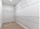 Spacious walk-in closet with multiple shelves for organization and carpeted flooring for comfort at 276 Stillbrook Dr., Longs, SC 29568