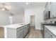 Well-equipped kitchen with granite counters, gray cabinets, a center island, and stainless-steel appliances at 276 Stillbrook Dr., Longs, SC 29568