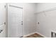 Mudroom features a white exterior door, a wire rack for storage, and neutral walls and flooring at 276 Stillbrook Dr., Longs, SC 29568
