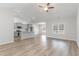 Open concept living space featuring the kitchen, dining and living rooms and wood-look flooring at 276 Stillbrook Dr., Longs, SC 29568