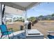 Covered patio features a grill, outdoor seating, and a well-maintained backyard at 2882 Ophelia Way, Myrtle Beach, SC 29577