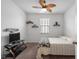 Bedroom with a ceiling fan, floating shelves, and a sleek TV stand provides a relaxing retreat at 2882 Ophelia Way, Myrtle Beach, SC 29577