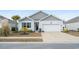 Charming single-story home with a well-manicured lawn and attached garage, perfect for a small Gathering or retirees at 2882 Ophelia Way, Myrtle Beach, SC 29577