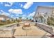 Outdoor fire pit with stone benches near a clubhouse and well-manicured lawns at 2882 Ophelia Way, Myrtle Beach, SC 29577