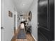 Inviting hallway features stylish decor and leads into a spacious living area with lots of natural light at 2882 Ophelia Way, Myrtle Beach, SC 29577